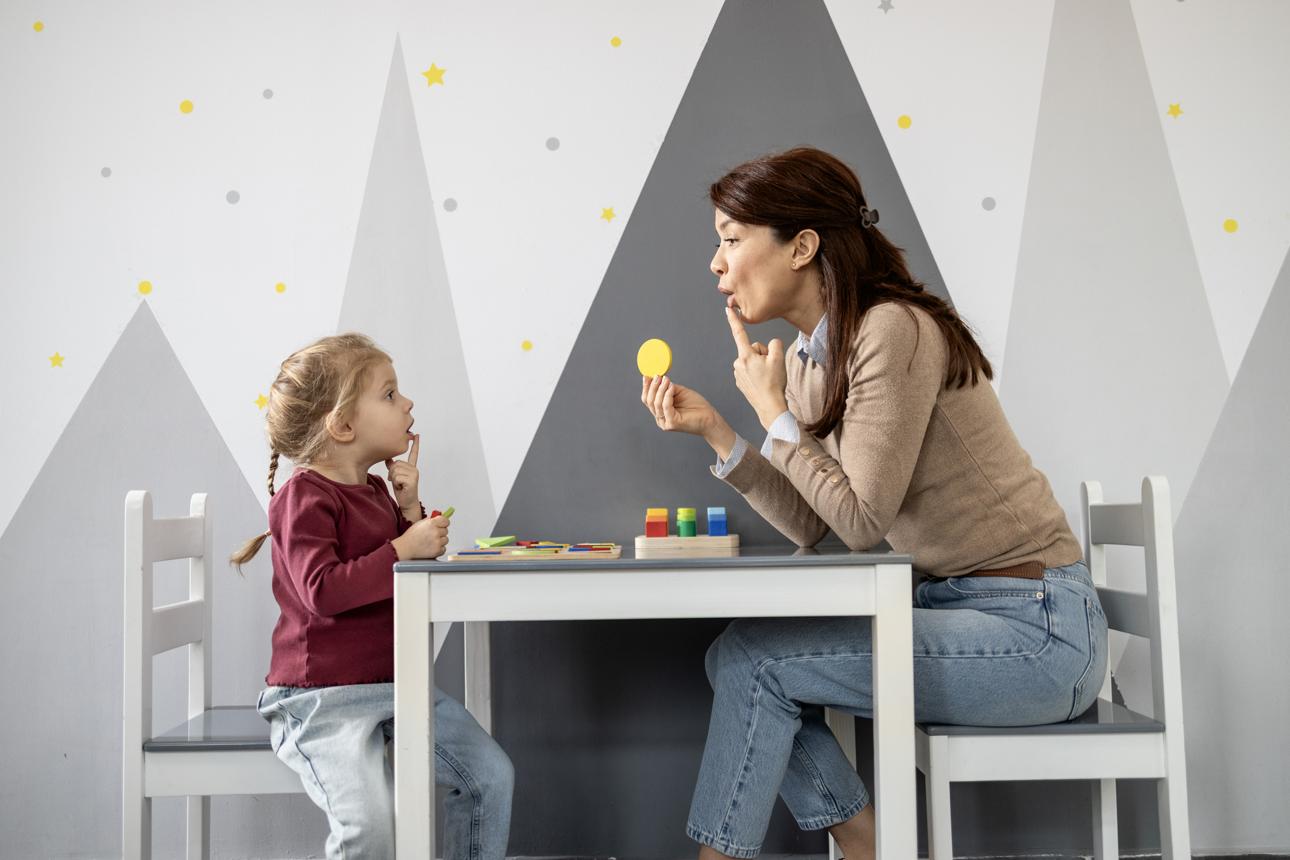 parent helping child improve speech at home